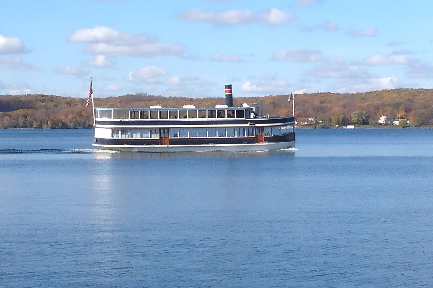 Steamboat cruising on a calm lake.