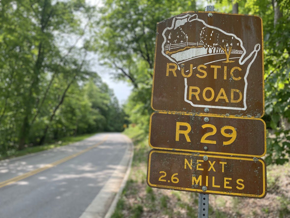 Rustic Road R29 sign on a tree-lined rural road.