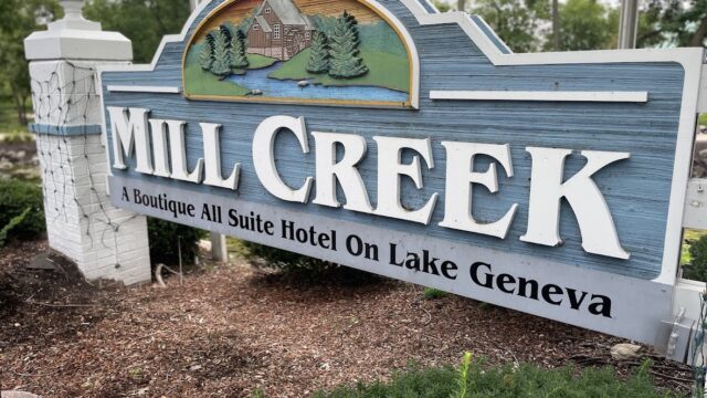 Entrance sign for Mill Creek apartment homes in Geneva.