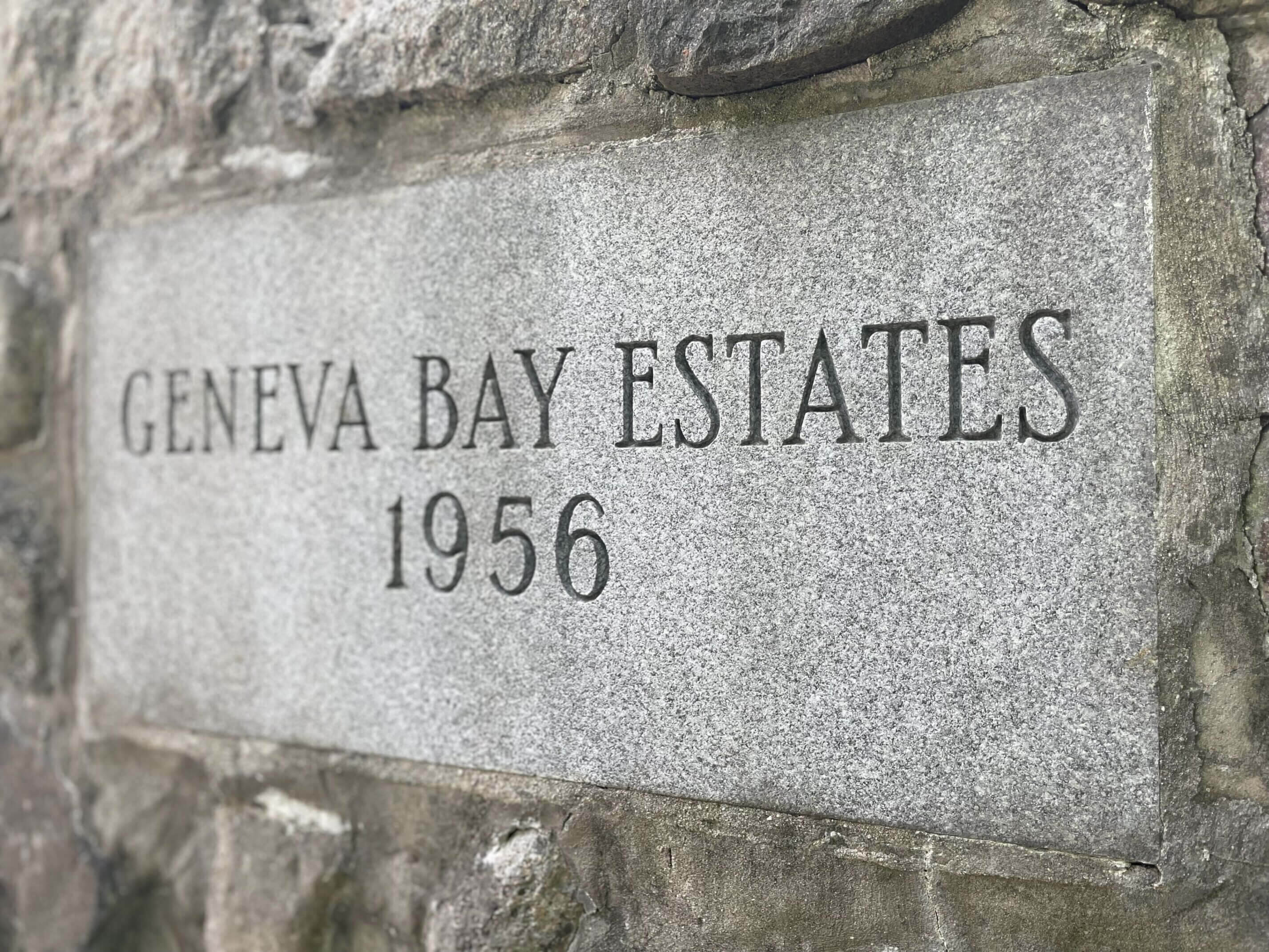 Stone plaque reading 'Geneva Bay Estates 1956'.
